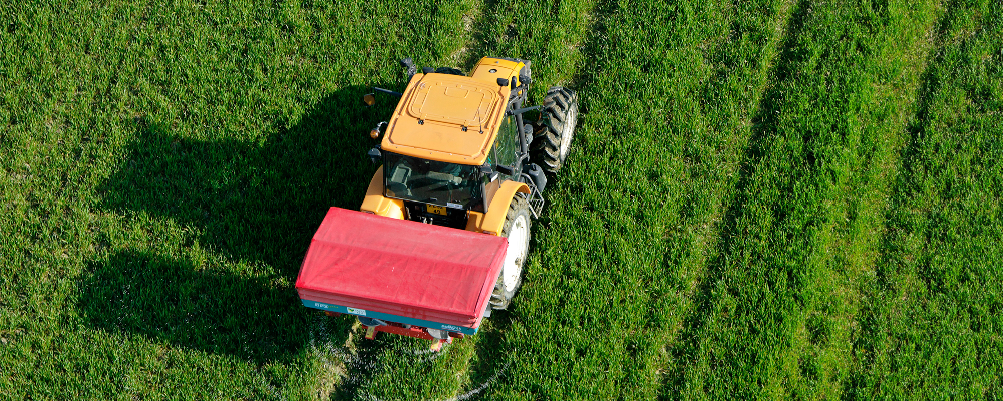 tractor-with-fertilizer-spreader-on-a-field-5-2